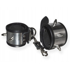 Серебристо-черные наручники с шипами и металлическим блеском Серебристо-черные наручники с шипами и металлическим блеском